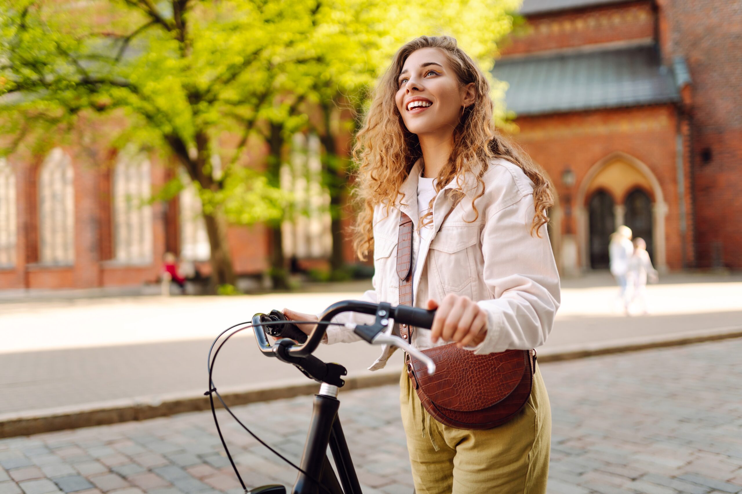 Happy,Woman,Riding,Bicycle,At,The,City,Street,Outdoor.,Freedom