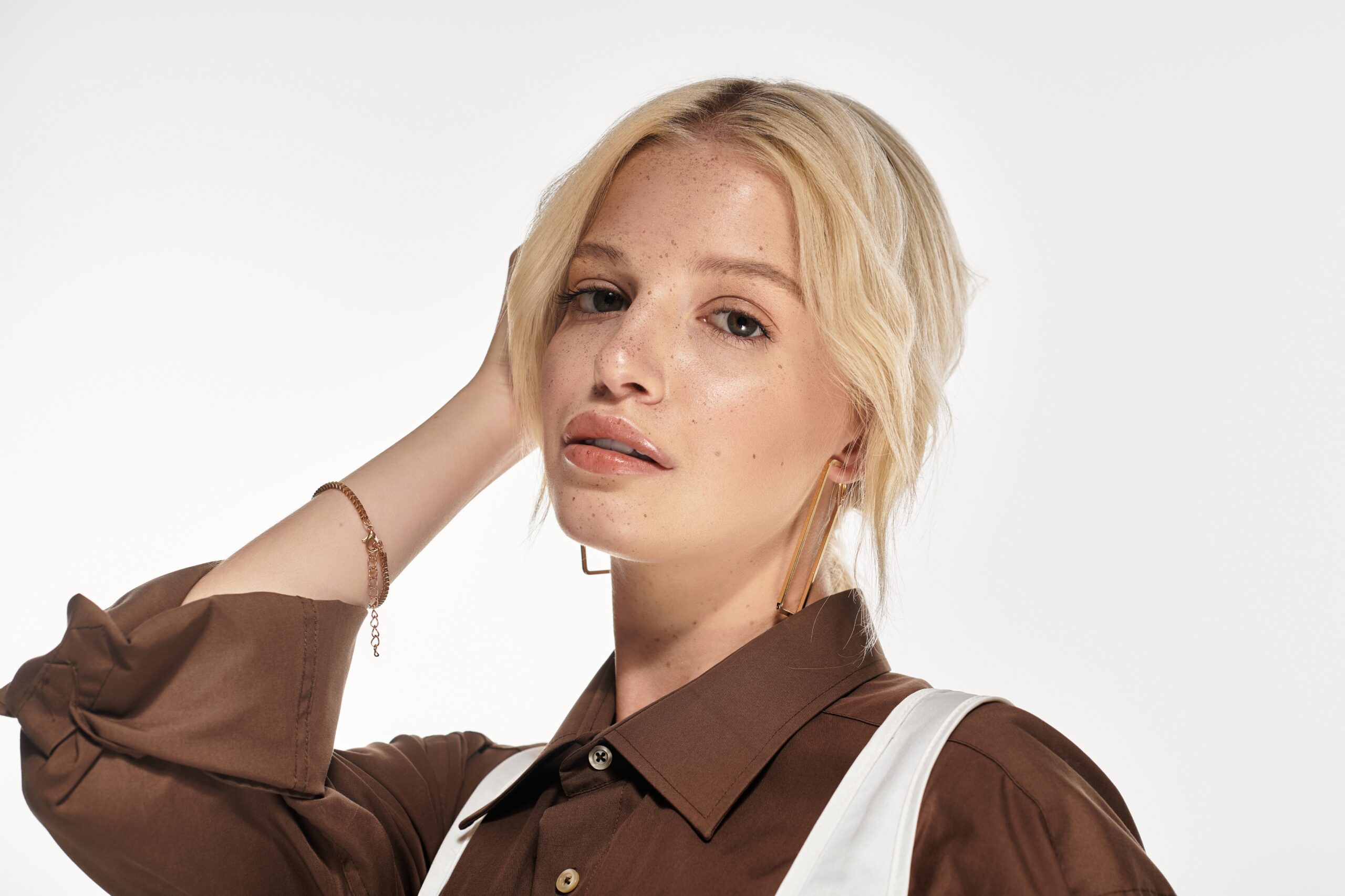 A,Stylish,Blonde,Woman,Showcases,Her,Fashion,Sense,In,An